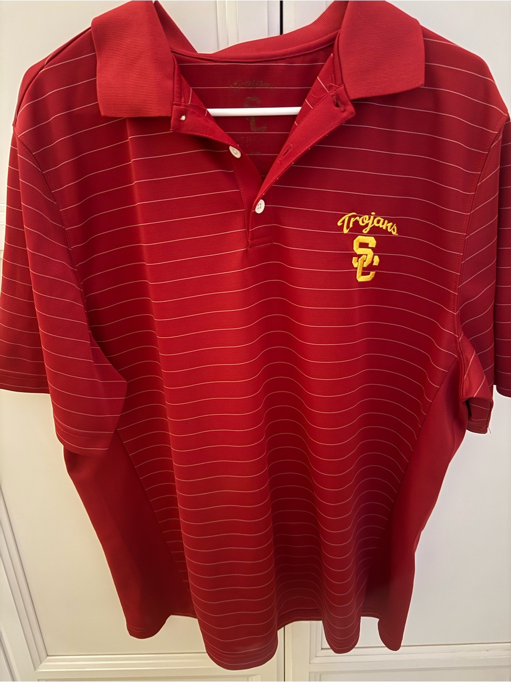 Nike Red Striped Trojans Polo with Yellow Embroidered Logo. Size is faded